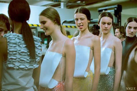 A female fashion model backstage at a fashion show